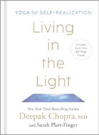 Hold a copy of Living in the Light