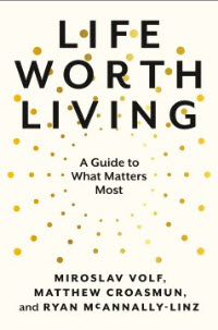 Hold a copy of Life Worth Living